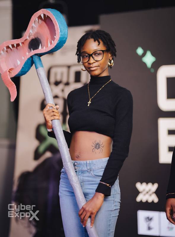 Cosplayer with a handmade prop